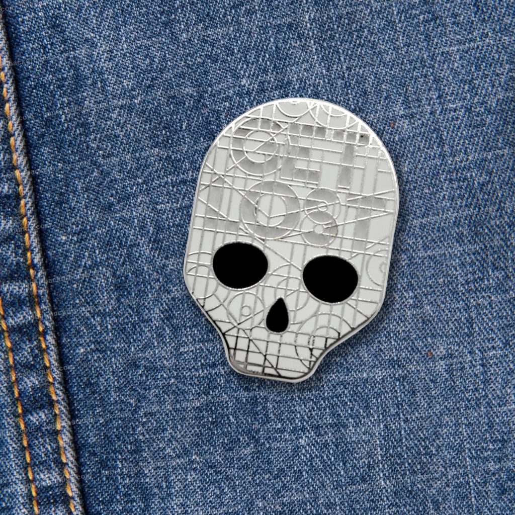 Glow in the Dark Get Lost Skull Pin from Haunts & Hollows